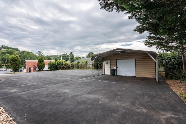 garage featuring a carport