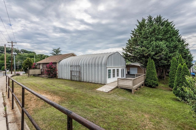 exterior space featuring an outdoor structure and a deck