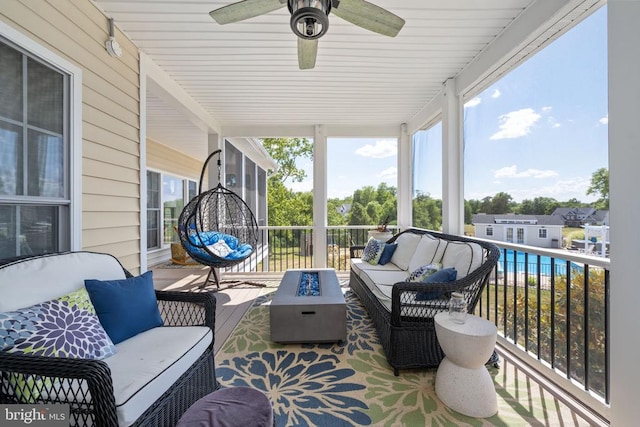 sunroom / solarium with ceiling fan