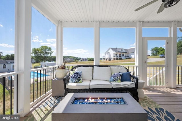 sunroom with ceiling fan and a healthy amount of sunlight