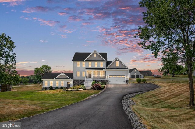 view of front facade featuring a yard and a garage