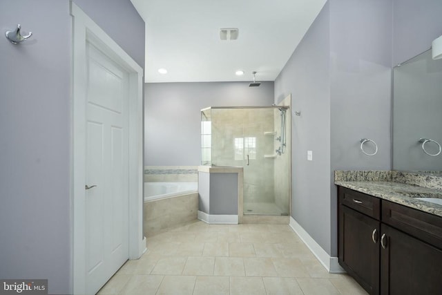 bathroom featuring vanity, tile patterned floors, and independent shower and bath