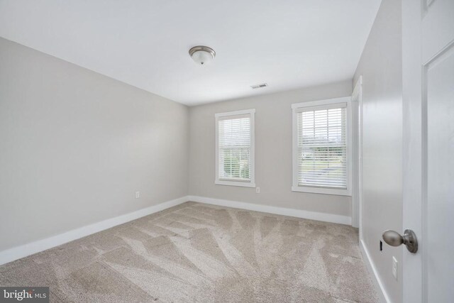 unfurnished room featuring carpet floors