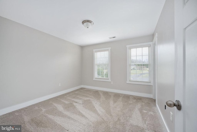 unfurnished room featuring carpet floors