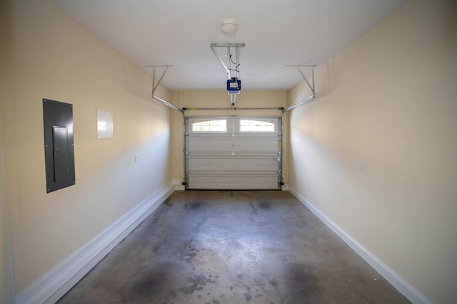 garage featuring electric panel, a garage door opener, and baseboards