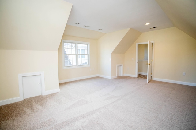 bonus room featuring lofted ceiling, light carpet, baseboards, and recessed lighting