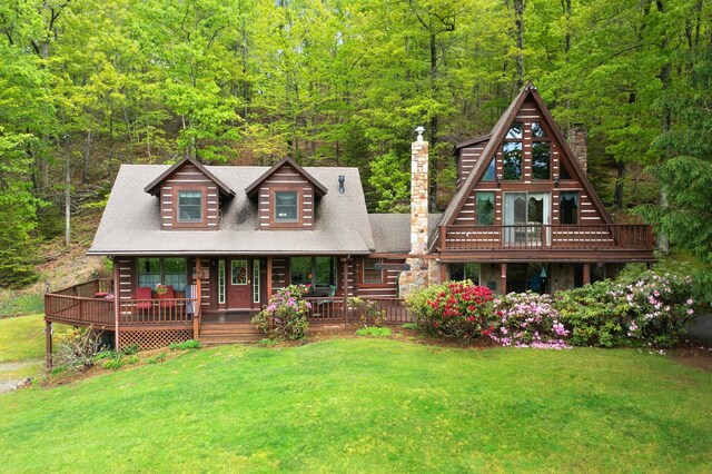 537 High Valley Dr N, Monterey, VA 24465 - view of front of home with a wooded view, a chimney, a front yard, and a porch