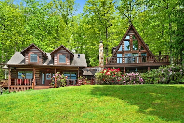 537 High Valley Dr N, Monterey, VA 24465 - rear view of house featuring a lawn, a chimney, and covered porch
