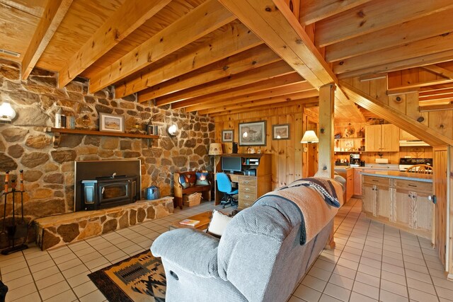 537 High Valley Dr N, Monterey, VA 24465 - living area with light tile patterned floors, a wood stove, beamed ceiling, and wooden ceiling