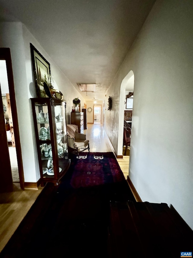 1820 Springhill Rd, Staunton, VA 24401 - hall with wood finished floors, arched walkways, attic access, and baseboards