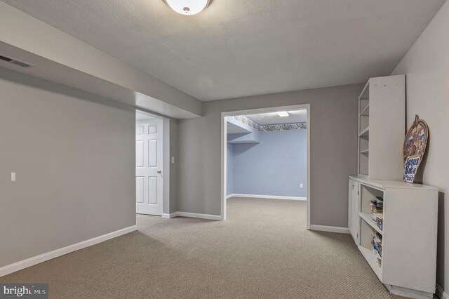 8802 Dundee Dr, Fredericksburg, VA 22408 - basement with light colored carpet