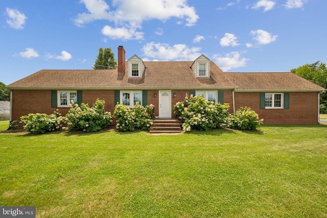 12014 Jefferson Hwy, Mineral, VA 23117 - new england style home with brick siding, a chimney, a front yard, and a shingled roof