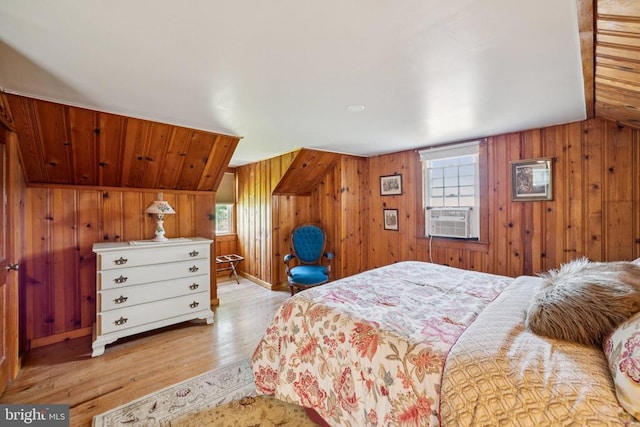 12014 Jefferson Hwy, Mineral, VA 23117 - bedroom with cooling unit, wood finished floors, wooden walls, and lofted ceiling