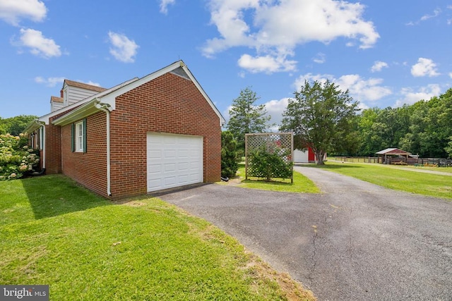 12014 Jefferson Hwy, Mineral, VA 23117 - view of home's exterior with brick siding, a lawn, and asphalt driveway