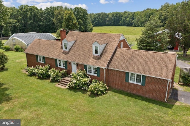 12014 Jefferson Hwy, Mineral, VA 23117 - cape cod home with brick siding, a chimney, a front yard, and roof with shingles