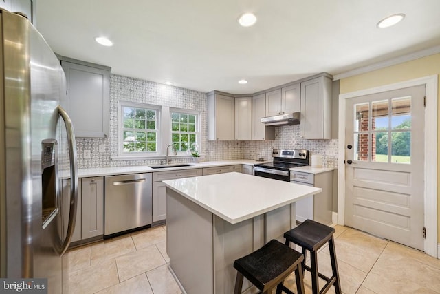 12014 Jefferson Hwy, Mineral, VA 23117 - kitchen with appliances with stainless steel finishes, gray cabinetry, under cabinet range hood, healthy amount of natural light, and recessed lighting