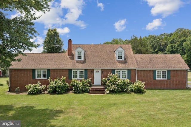 12014 Jefferson Hwy, Mineral, VA 23117 - new england style home featuring brick siding, a chimney, and a front lawn