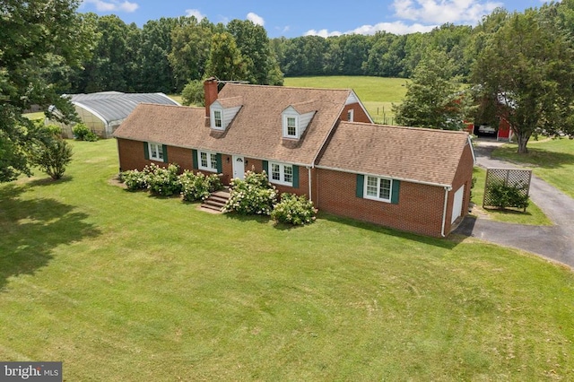 12014 Jefferson Hwy, Mineral, VA 23117 - cape cod home with brick siding, an attached garage, driveway, french doors, and a front lawn