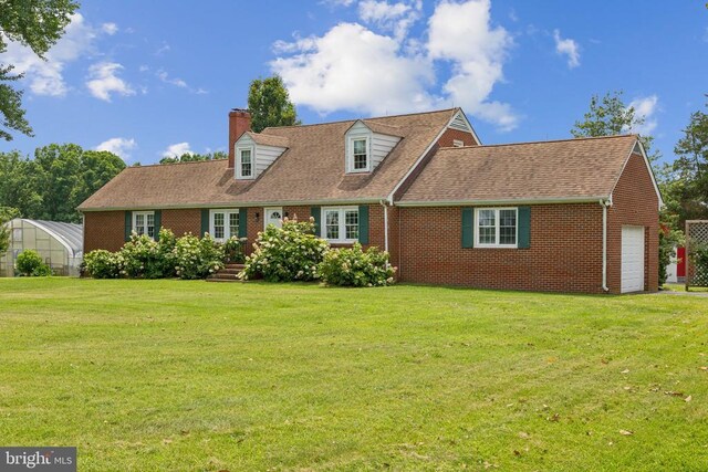 12014 Jefferson Hwy, Mineral, VA 23117 - cape cod house with brick siding, an exterior structure, a chimney, a front yard, and an attached garage