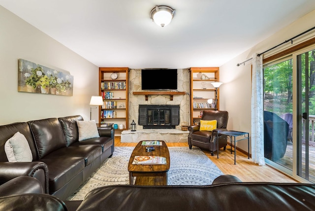 321 Quail Ct, Mcgaheysville, VA 22840 - living area featuring wood finished floors, a fireplace, and built in shelves
