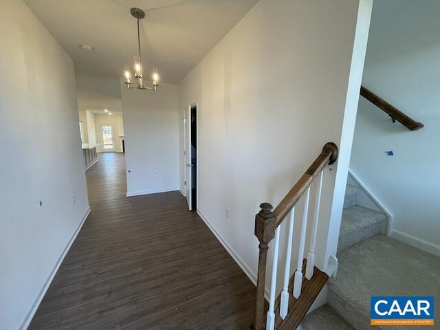374 Bayberry Ln Unit F3C-20, Zion Crossroads, VA 22942 - hallway featuring a chandelier, dark wood-type flooring, and baseboards