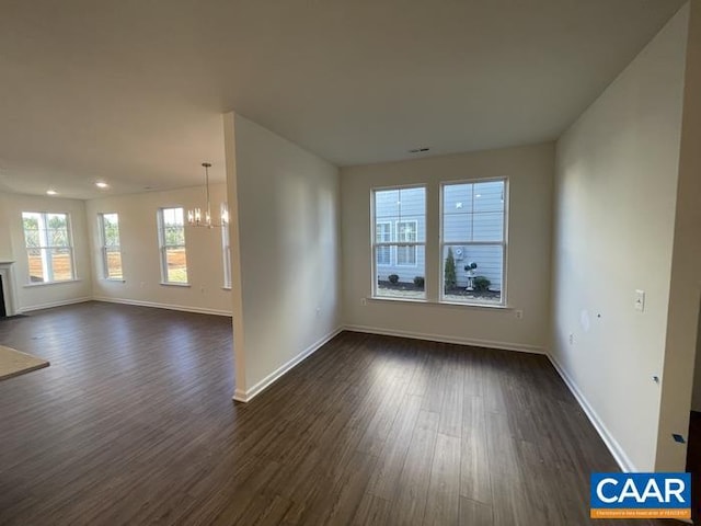 374 Bayberry Ln Unit F3C-20, Zion Crossroads, VA 22942 - empty room featuring a chandelier, dark wood-type flooring, and baseboards