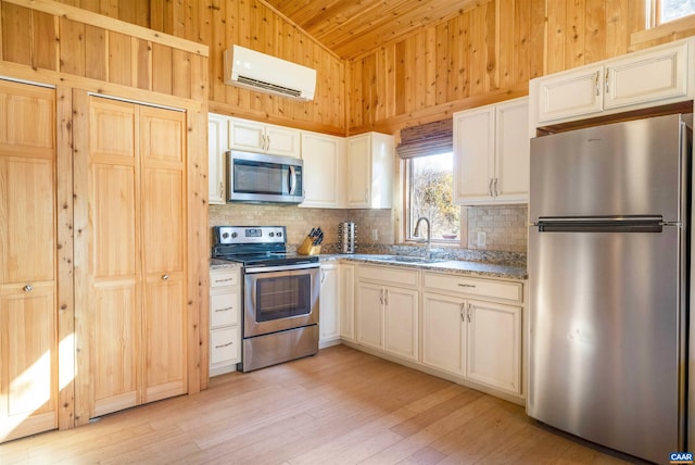 7930 Old Green Mountain Rd, Esmont, VA 22937 - kitchen featuring a wall mounted AC, stainless steel appliances, tasteful backsplash, and a sink