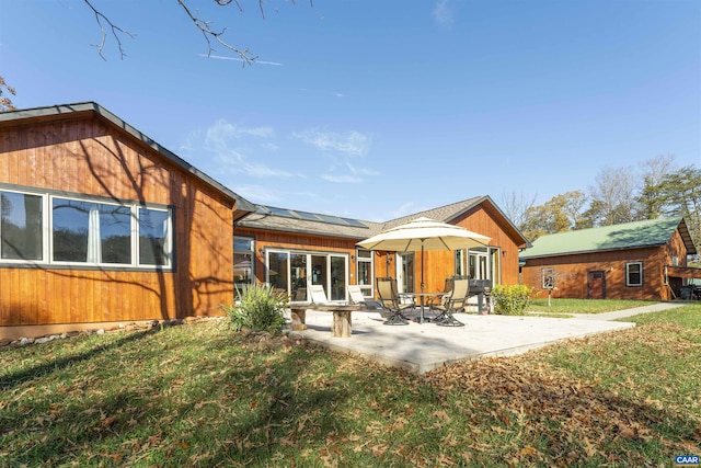 7930 Old Green Mountain Rd, Esmont, VA 22937 - rear view of house featuring a lawn, a patio, and solar panels