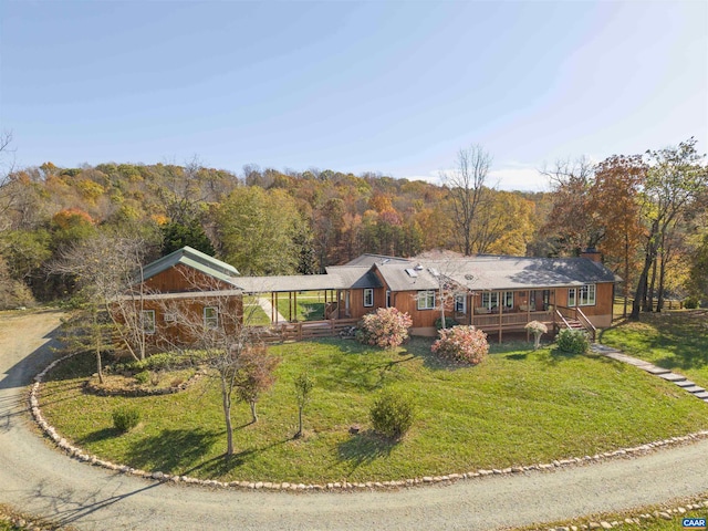 7930 Old Green Mountain Rd, Esmont, VA 22937 - view of front of home featuring a deck, a forest view, a chimney, and a front yard