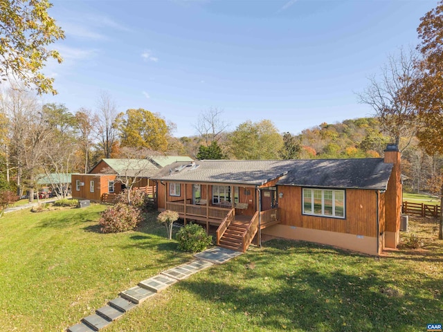 7930 Old Green Mountain Rd, Esmont, VA 22937 - view of front of property featuring a chimney, a deck, roof with shingles, and a front lawn