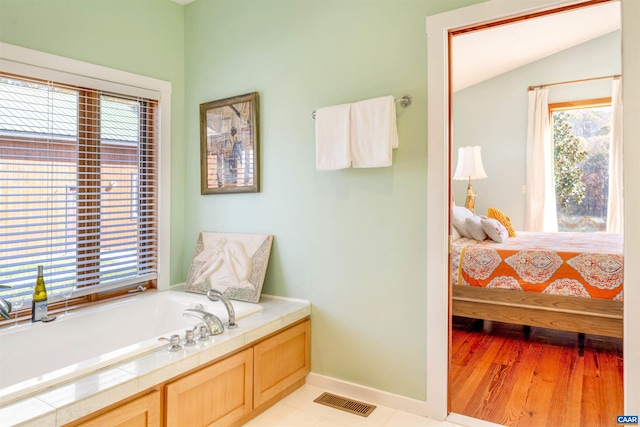 7930 Old Green Mountain Rd, Esmont, VA 22937 - bathroom featuring baseboards, a healthy amount of sunlight, and visible vents