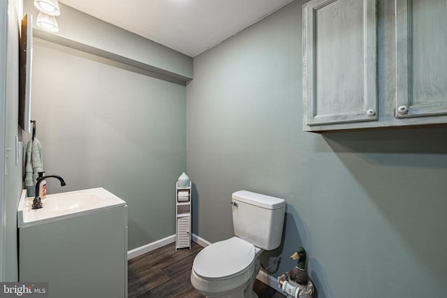 166 John Tucker Rd, Madison, VA 22727 - bathroom featuring toilet, vanity, wood finished floors, and baseboards