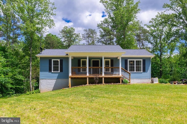 166 John Tucker Rd, Madison, VA 22727 - view of front facade with covered porch, a front yard, and a shingled roof
