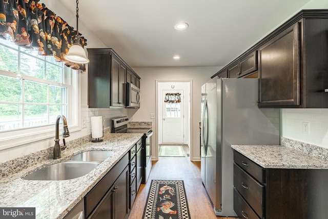 166 John Tucker Rd, Madison, VA 22727 - kitchen featuring stainless steel appliances, a sink, dark brown cabinetry, recessed lighting, and tasteful backsplash
