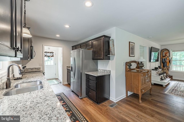 166 John Tucker Rd, Madison, VA 22727 - kitchen featuring stainless steel appliances, a sink, wood finished floors, dark brown cabinetry, and baseboards