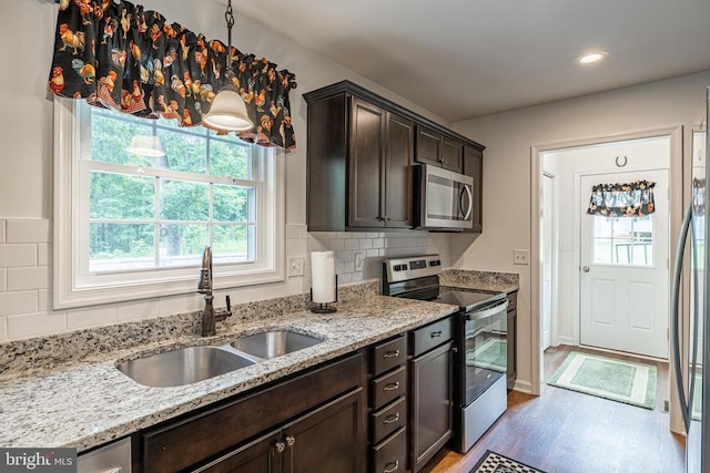 166 John Tucker Rd, Madison, VA 22727 - kitchen with appliances with stainless steel finishes, a sink, dark brown cabinetry, healthy amount of natural light, and recessed lighting