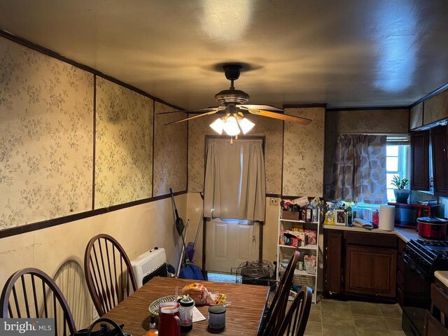 13093 Stonehouse Mountain Rd, Culpeper, VA 22701 - dining space featuring wallpapered walls, ceiling fan, and tile patterned floors