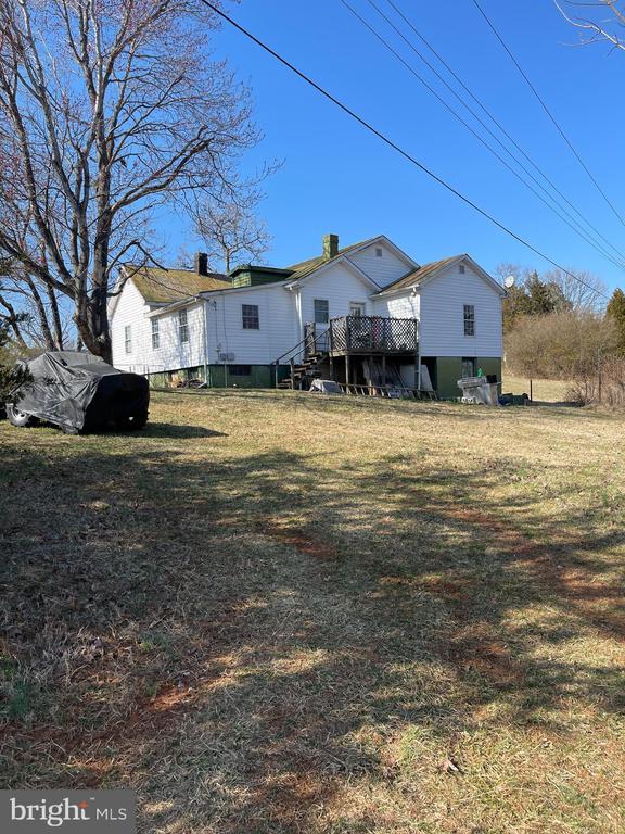 13093 Stonehouse Mountain Rd, Culpeper, VA 22701 - view of grassy yard with a wooden deck