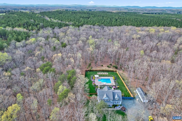 aerial view with a wooded view