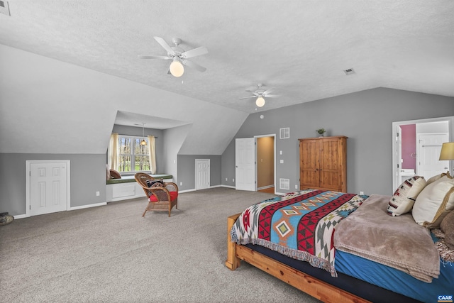 bedroom with baseboards, visible vents, and vaulted ceiling