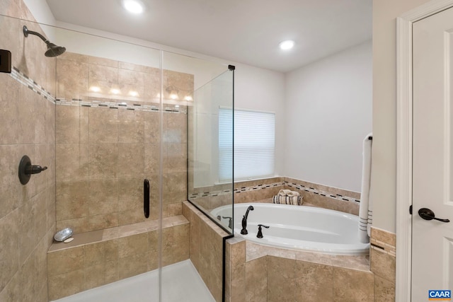 bathroom with a garden tub, a shower stall, and recessed lighting