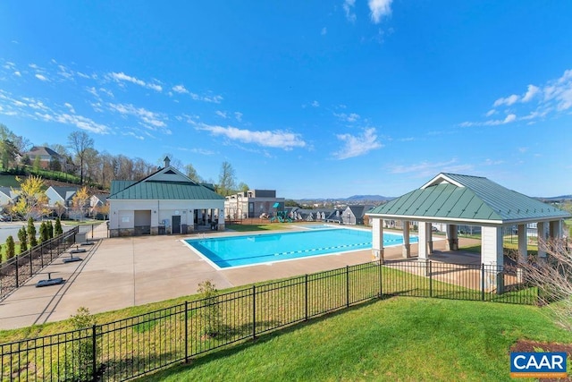 community pool featuring a gazebo and a patio area
