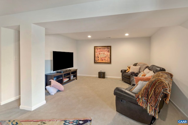 carpeted living room featuring baseboards and recessed lighting