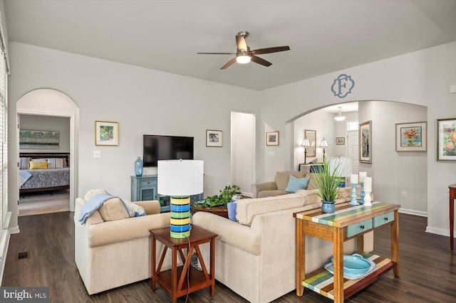 14219 Belle Ave, Culpeper, VA 22701 - living room with arched walkways, ceiling fan, dark wood-style floors, and baseboards