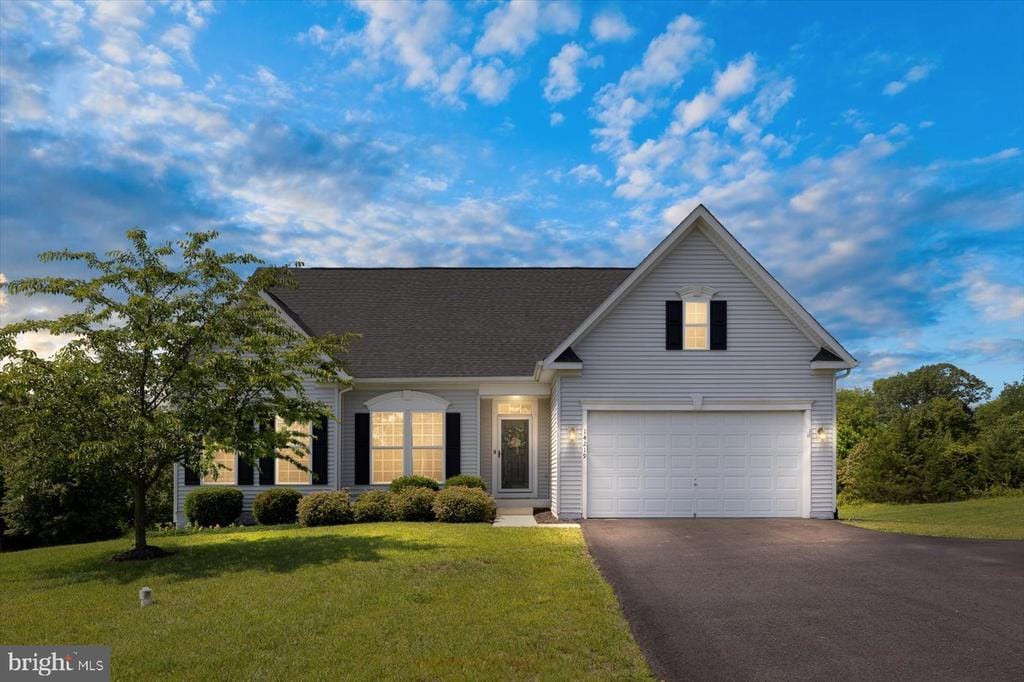 14219 Belle Ave, Culpeper, VA 22701 - traditional home featuring asphalt driveway, a front lawn, a garage, and a shingled roof