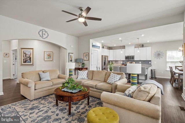 14219 Belle Ave, Culpeper, VA 22701 - living room with ceiling fan, dark wood-type flooring, arched walkways, baseboards, and recessed lighting
