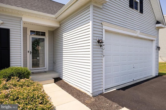 14219 Belle Ave, Culpeper, VA 22701 - property entrance featuring roof with shingles and an attached garage