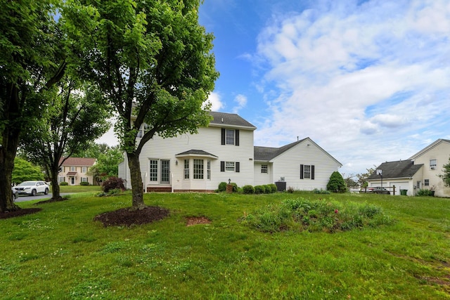 82 Pheasant Run, Waynesboro, VA 22980 - back of property with a lawn and central AC
