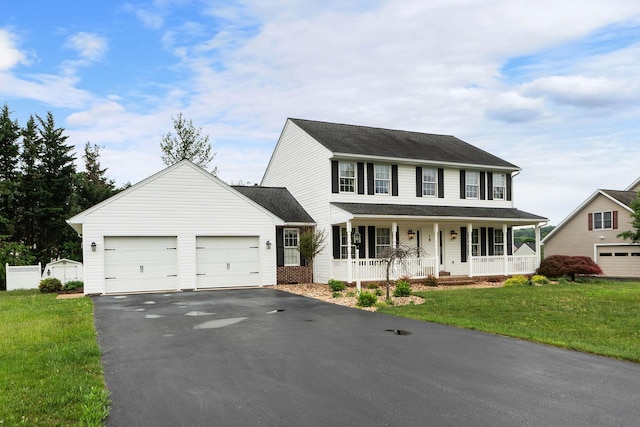 82 Pheasant Run, Waynesboro, VA 22980 - colonial-style house featuring a porch, driveway, an attached garage, and a front yard