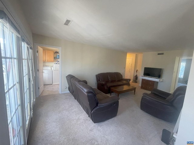 1520 Villa Ter Unit E, Charlottesville, VA 22903 - living room with carpet floors, visible vents, and washer and dryer